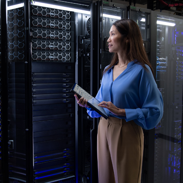 Lady stands in front of a server holding a tablet.