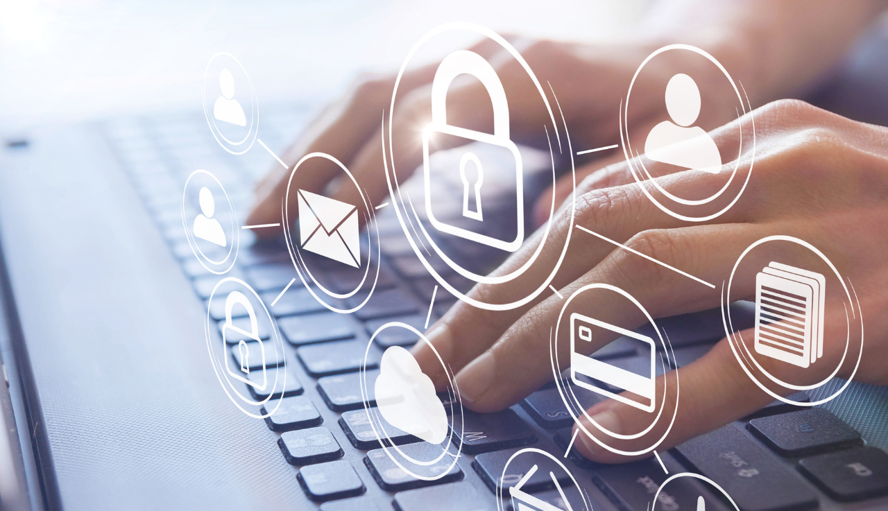 Close up of a person typing on a laptop.