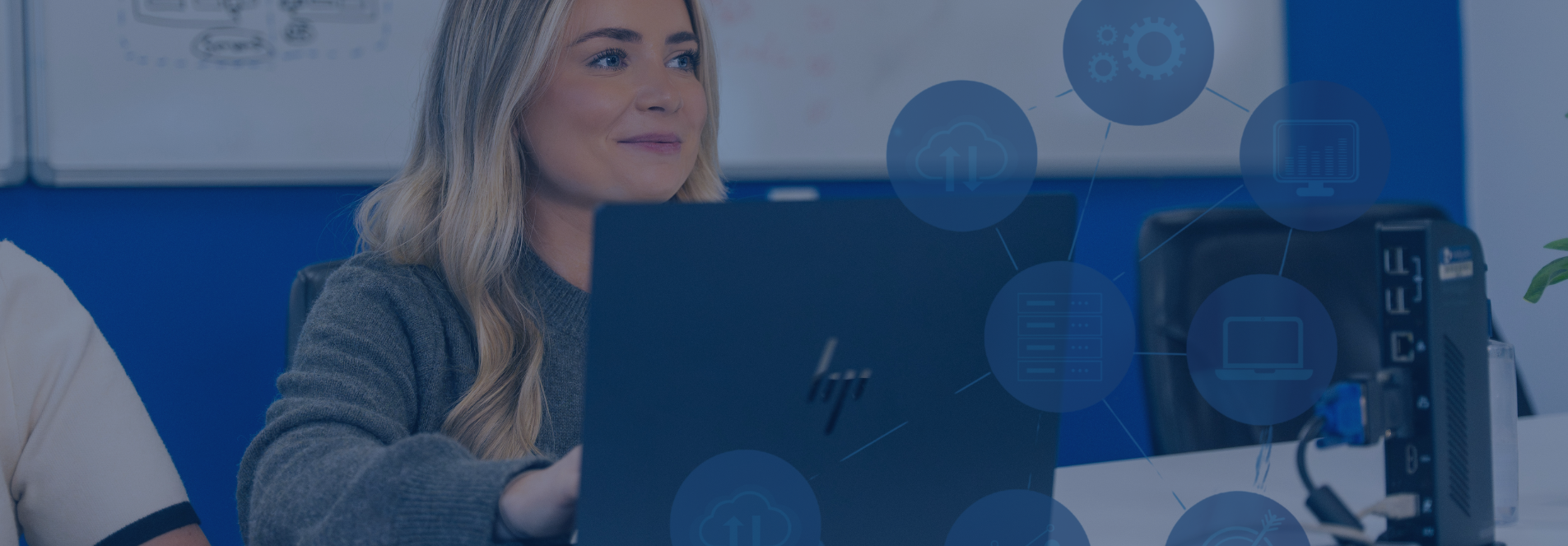 Millgate staff member sat in meeting discussing IT Process Strategy. 