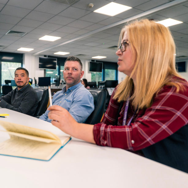 Team in a meeting at an office.