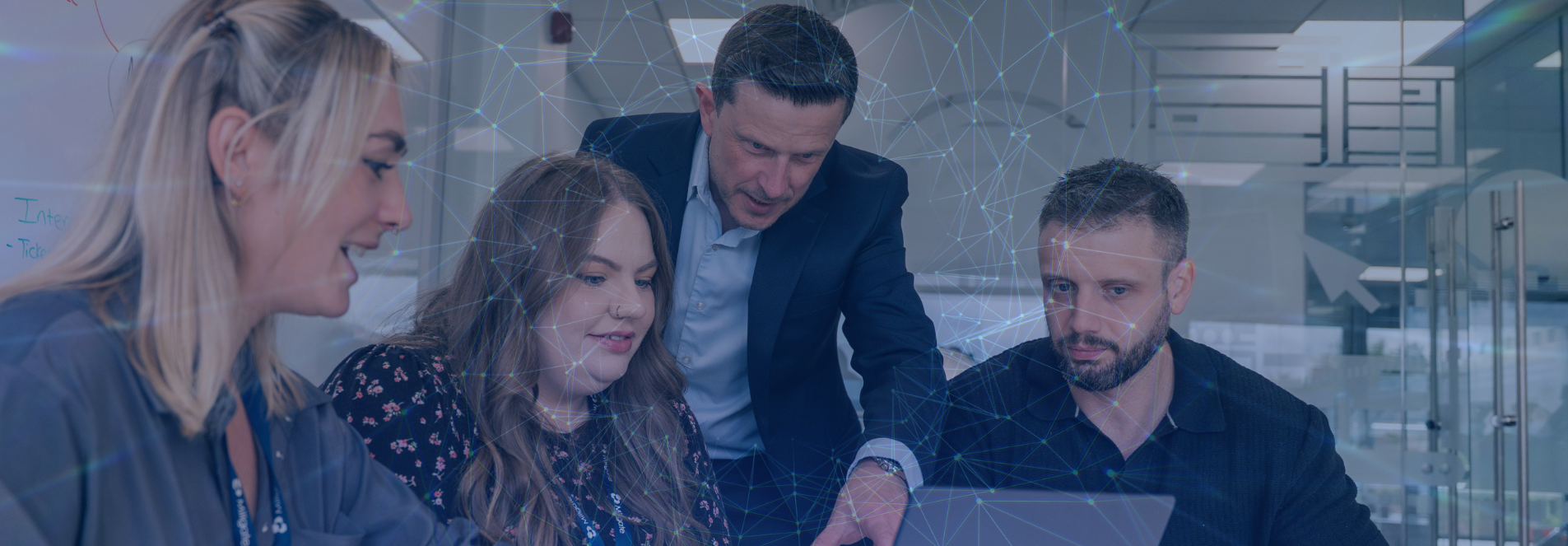 Millgate team reviewing positive outcomes on a laptop 