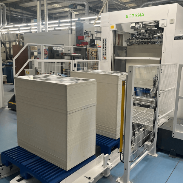 Inside the printing press building showcasing the factory machines.