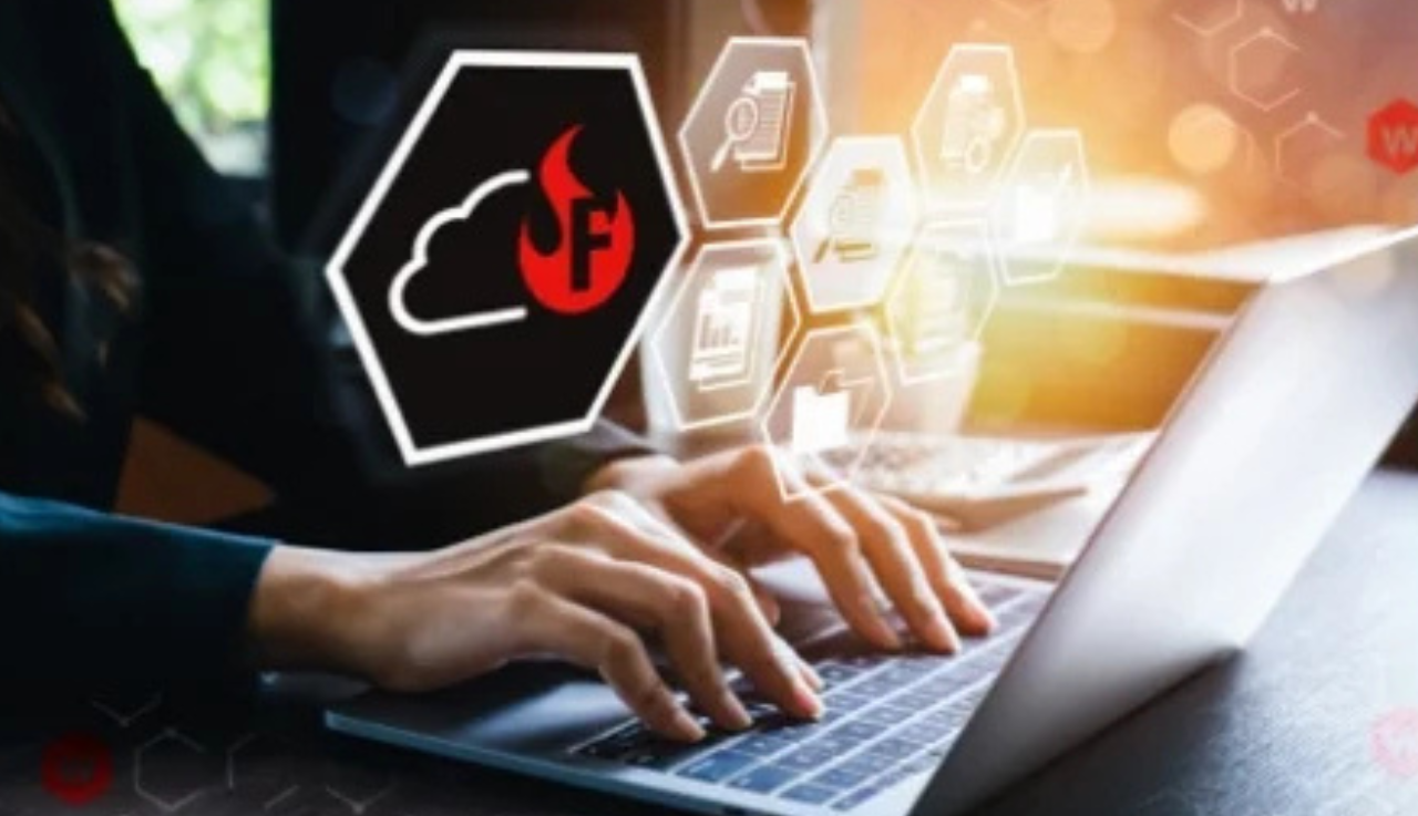 A close up of a person typing on a laptop, an overlay graphic of a frebox sits overtop.